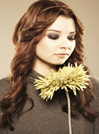 Close-up of an attractive fashion woman with a flower